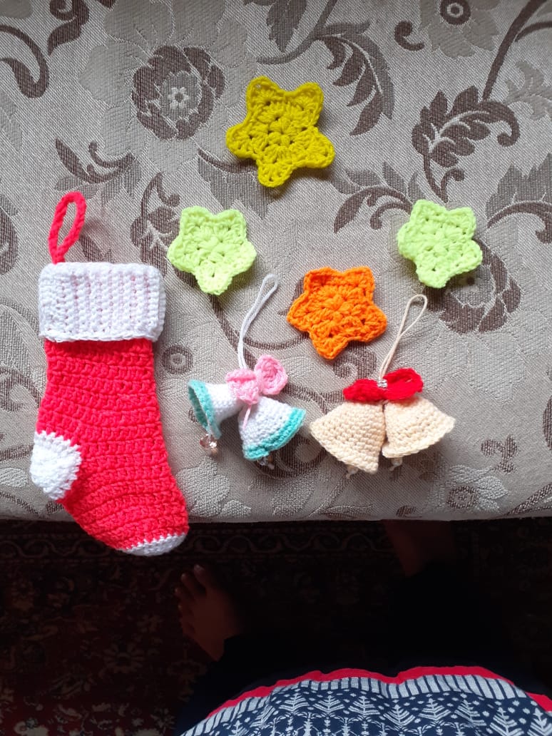 The Festive Collection — a crocheted Christmas set including a stocking, stars and bell ornaments