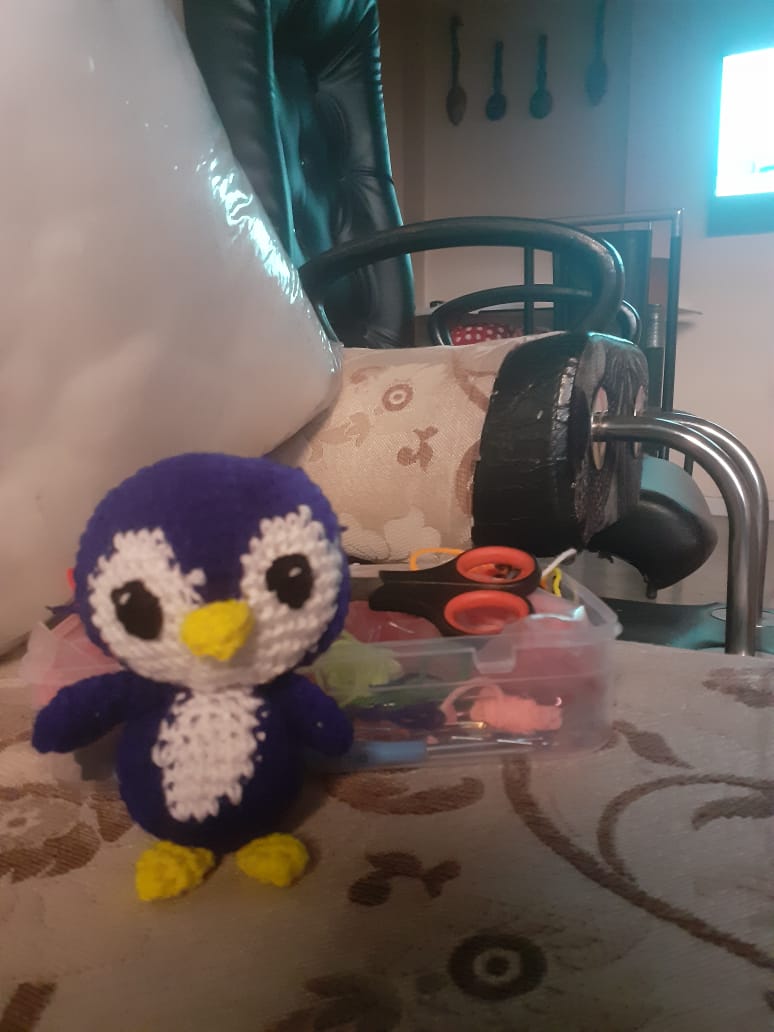 Pip the Penguin — a small navy and white crocheted penguin amigurumi