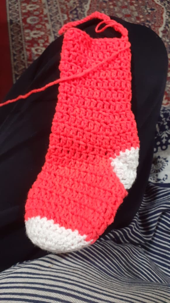 The Hearth Stocking — a classic red and white crocheted Christmas stocking